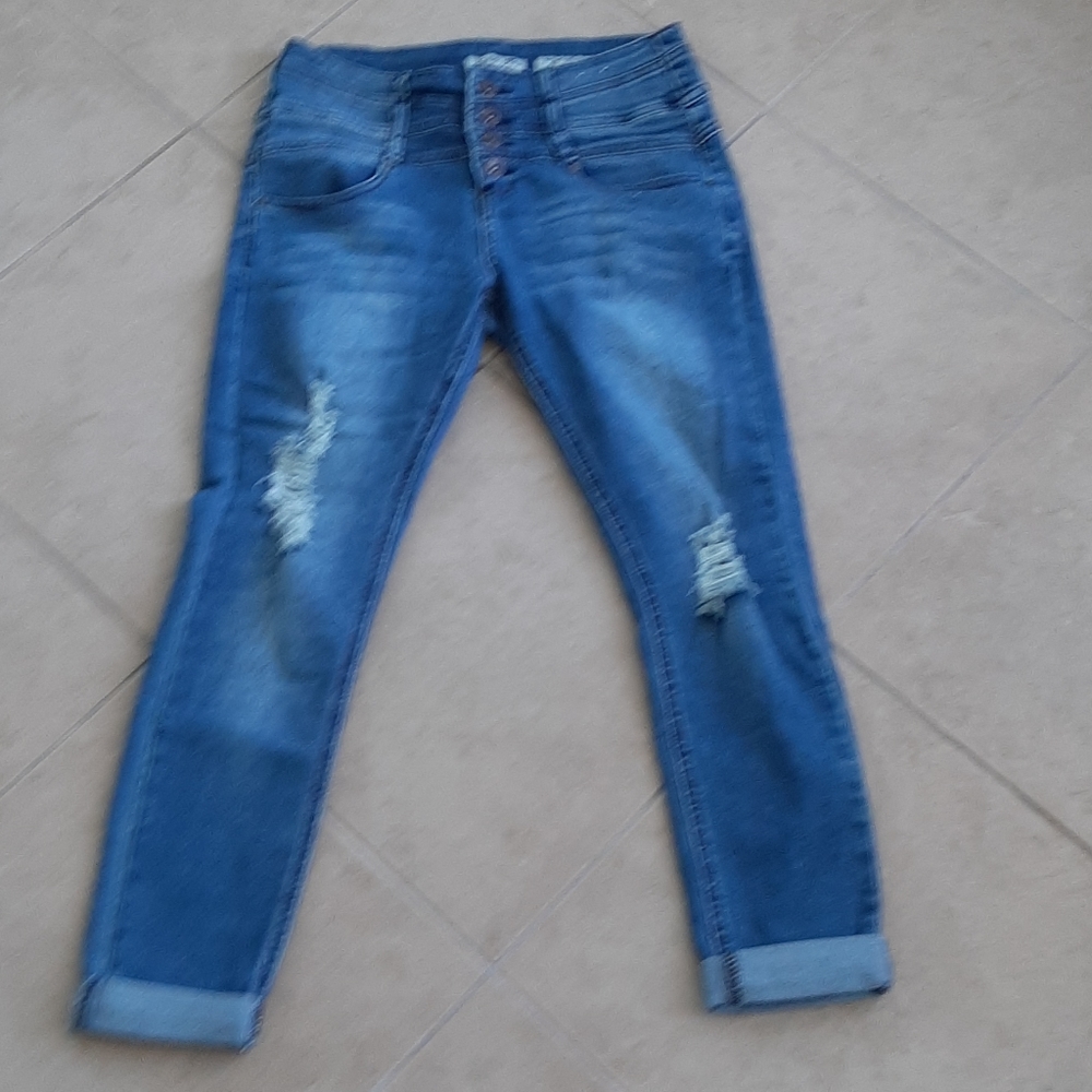 Ripped button fly cuffed jeans